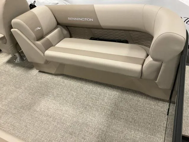 Slide: The Image of 2025 Bennington 22 SSR boat interior with beige seating and carpet flooring. - 5