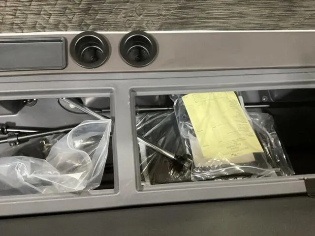 Slide: The Image of Interior storage compartment of 2025 Bennington M Quad Bench 26 MFB boat. - 13