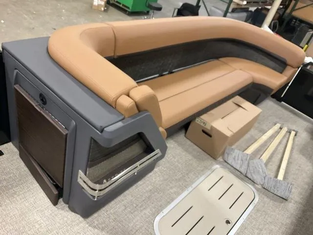 Slide: The Image of 2025 Bennington M Quad Bench 26 MFB with tan seating and storage boxes. - 8