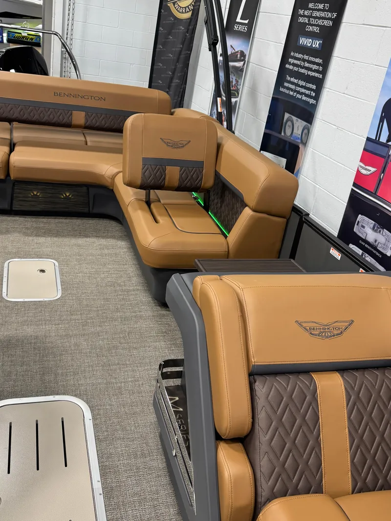 Slide: The Image of 2025 Bennington M Swingback 24 MSB interior with luxurious tan and brown seating. - 15