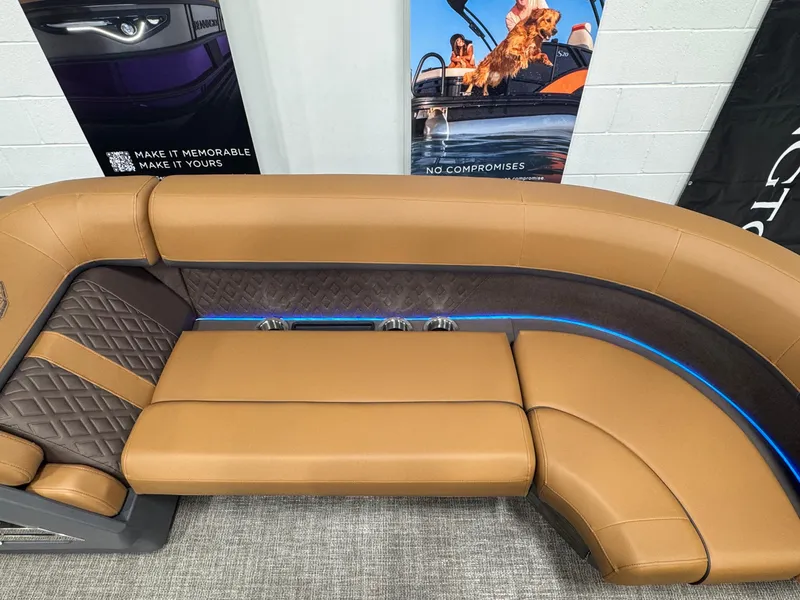 Slide: The Image of Luxurious seating on 2025 Bennington M Swingback 24 MSB boat, featuring tan upholstery and modern design. - 20