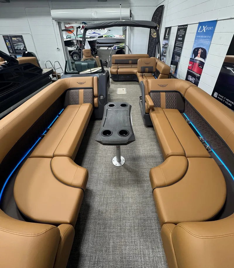 Slide: The Image of 2025 Bennington M Swingback 24 MSB interior with luxurious tan seating and modern design. - 23