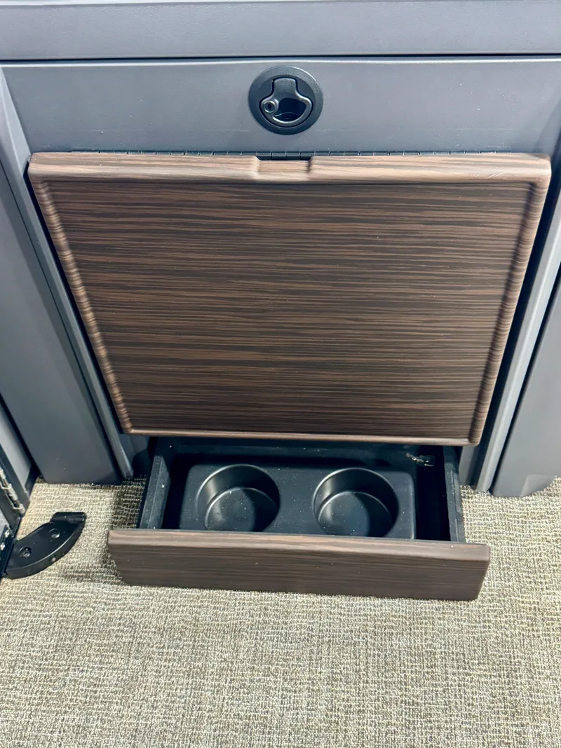 Slide: The Image of 2025 Bennington M Swingback 24 MSB with built-in cup holders and storage compartment. - 28