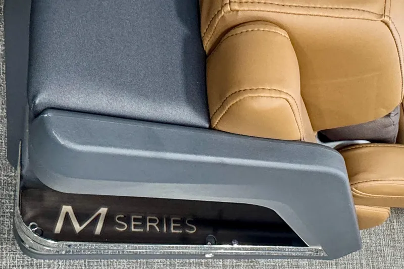 Slide: The Image of 2025 Bennington M Series Swingback 24 MSB seat detail with tan upholstery. - 29