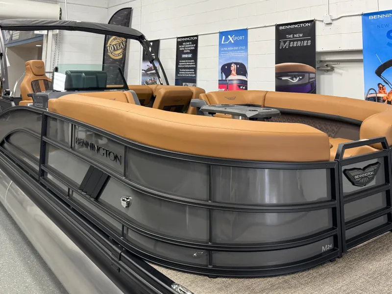 Slide: The Image of 2025 Bennington M Swingback 24 MSB pontoon boat with luxurious seating and sleek design. - 3