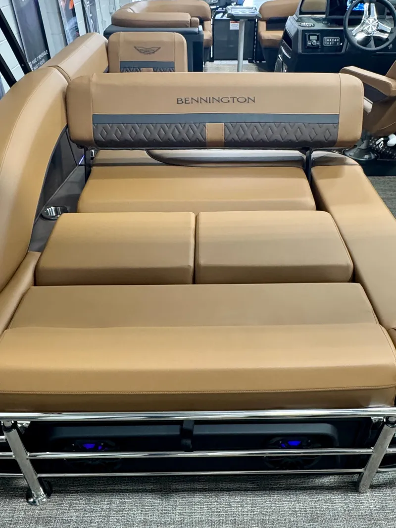 Slide: The Image of 2025 Bennington M Swingback 24 MSB boat interior with luxurious tan seating. - 30