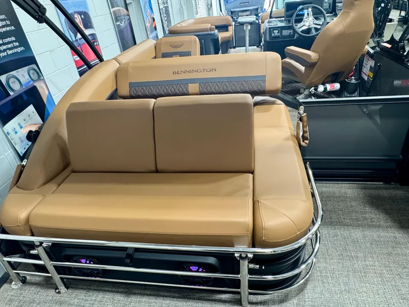 Slide: The Image of 2025 Bennington M Swingback 24 MSB boat interior with tan seating and modern design. - 31