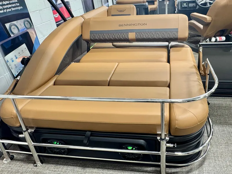 Slide: The Image of 2025 Bennington M Swingback 24 MSB boat interior with tan seating and stainless steel railing. - 32