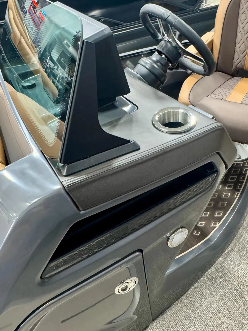 Slide: The Image of 2025 Bennington M Swingback 24 MSB interior with steering wheel and cup holder. - 8