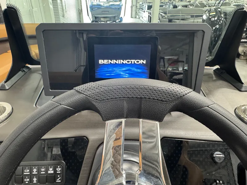 Slide: The Image of Dashboard of 2025 Bennington M Swingback 24 MSB with digital display and steering wheel. - 9