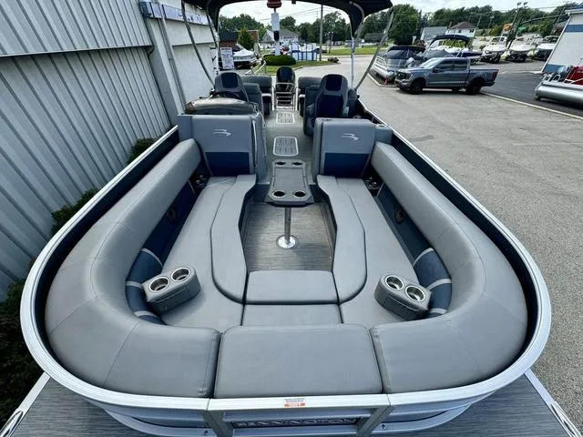 Slide: The Image of 2022 Bennington 25 LTSB pontoon boat with spacious seating and modern design. - 11
