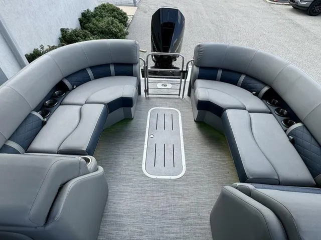Slide: The Image of 2022 Bennington 25 LTSB pontoon boat with spacious seating and modern design. - 26