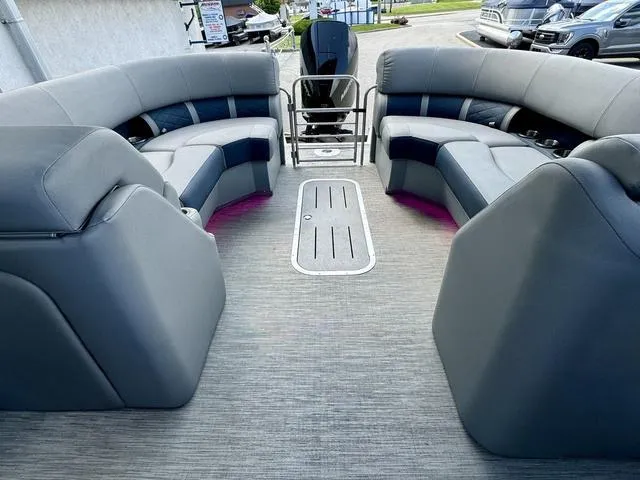 Slide: The Image of 2022 Bennington 25 LTSB pontoon boat interior with spacious seating and modern design. - 28