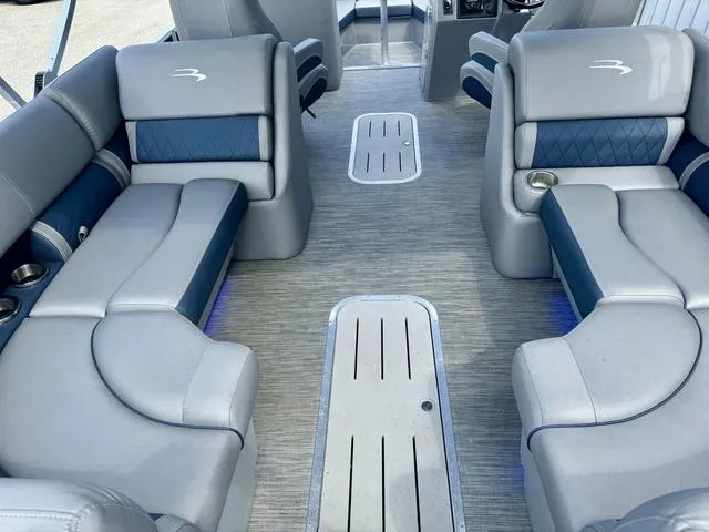 Slide: The Image of Luxurious interior of a 2022 Bennington 25 LTSB pontoon boat with plush seating. - 29