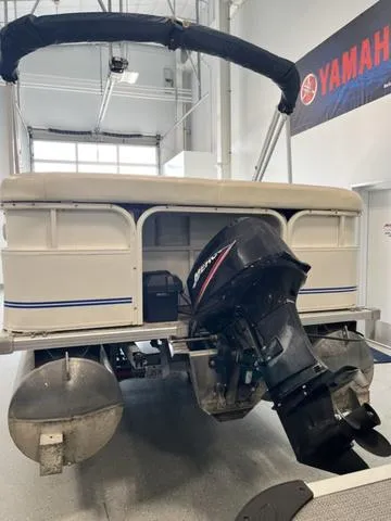 Slide: The Image of 2006 Bentley Pontoons Duracraft 24 Cruise with outboard motor in showroom. - 3