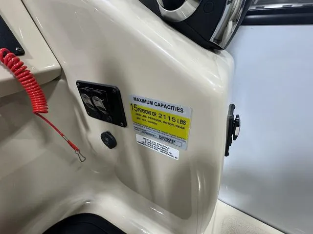 Slide: The Image of 2019 SunChaser 8525 Entertainer boat capacity label, 15 persons or 2,115 lbs limit. - 12