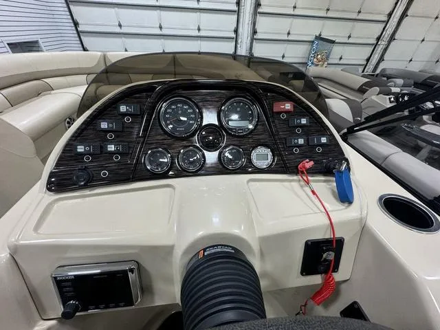Slide: The Image of Control panel of a 2019 SunChaser 8525 Entertainer boat with gauges and switches. - 14