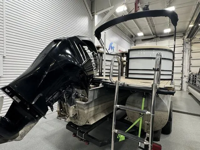 Slide: The Image of 2019 SunChaser 8525 Entertainer pontoon boat with Mercury outboard motor in a garage. - 3