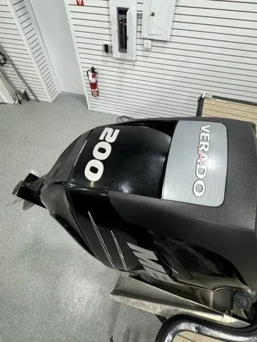 Slide: The Image of 2019 SunChaser 8525 Entertainer with Verado 200 outboard motor in showroom. - 4