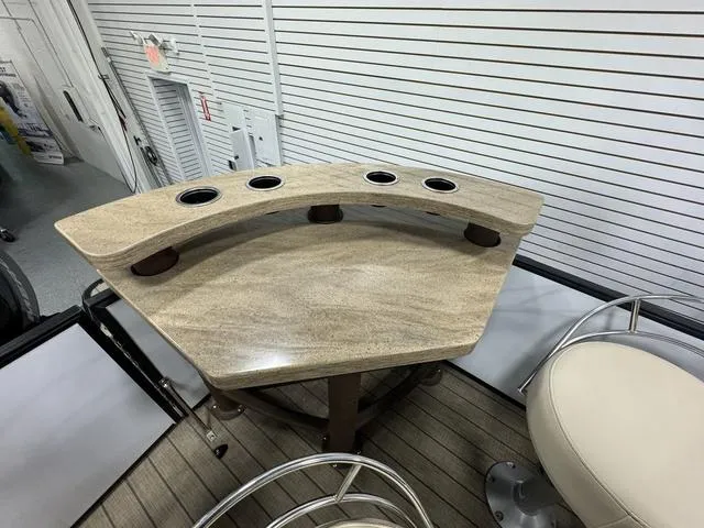 Slide: The Image of 2019 SunChaser 8525 Entertainer boat with a stylish bar table and cup holders. - 7