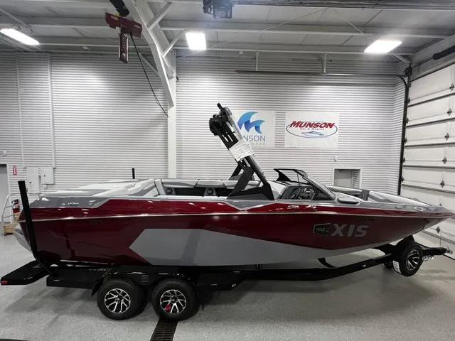 Slide: The Image of 2024 Axis Wake Research A245 boat in showroom, featuring sleek design and modern detailing. - 1