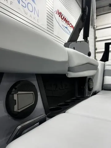 Slide: The Image of 2024 Axis Wake Research A245 interior with speakers and cup holders. - 15