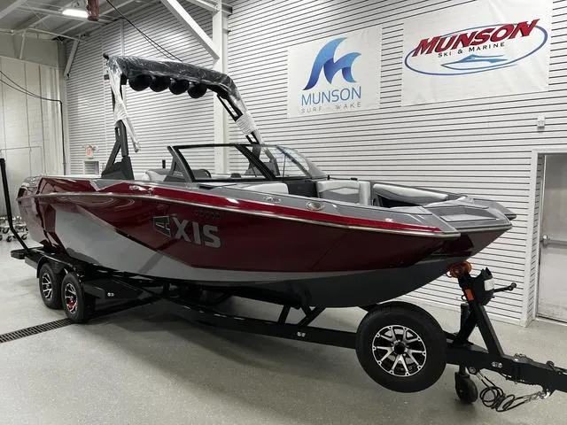 Slide: The Image of 2024 Axis Wake Research A245 boat on trailer in showroom. - 2