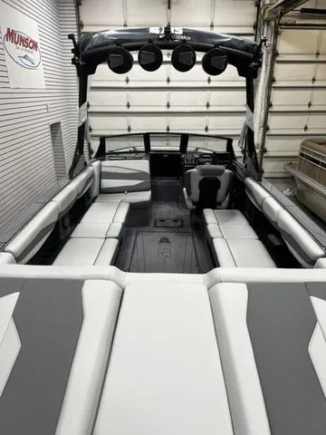 Slide: The Image of 2024 Axis Wake Research A245 boat interior with spacious seating and modern design. - 6