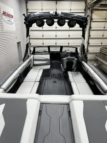 Slide: The Image of 2024 Axis Wake Research A245 boat interior with sleek seating and modern design. - 7