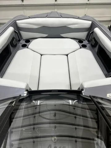 Slide: The Image of 2024 Axis Wake Research A245 boat interior with white cushioned seating. - 8