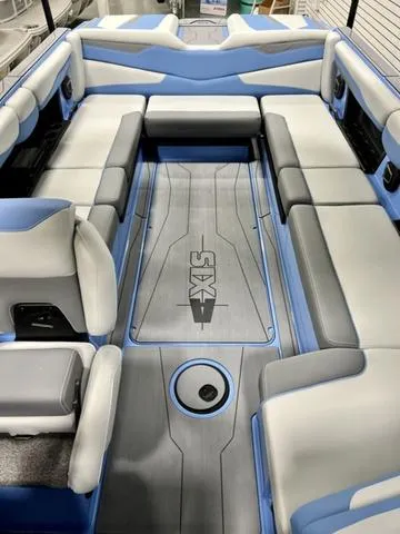 Slide: The Image of 2024 Axis Wake Research T250 boat interior with blue and gray seating. - 10