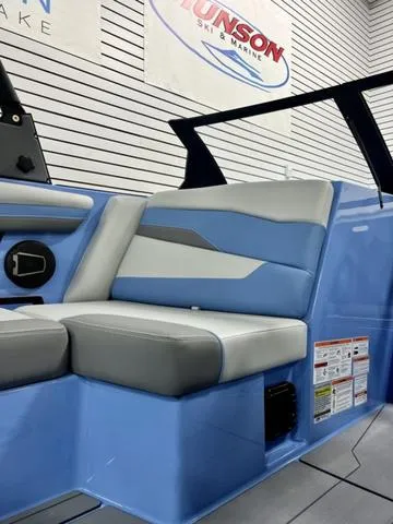 Slide: The Image of 2024 Axis Wake Research T250 boat interior with blue and gray seating. - 14
