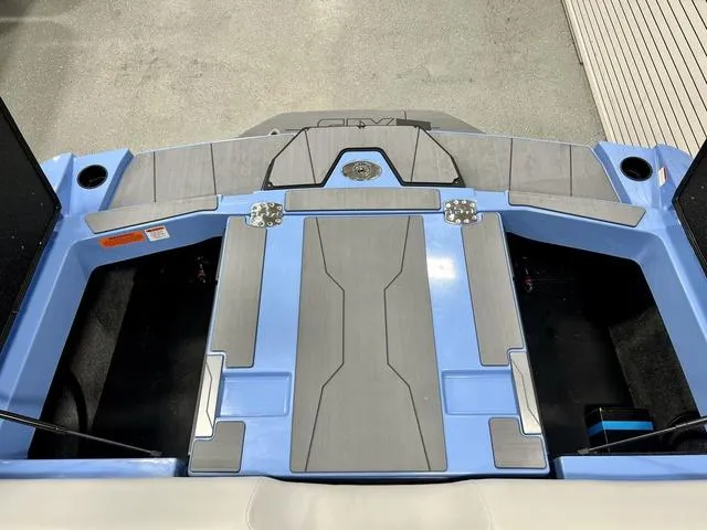 Slide: The Image of 2024 Axis Wake Research T250 boat deck with blue and gray design. - 16