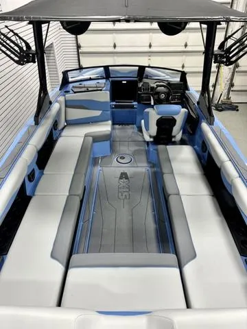 Slide: The Image of 2024 Axis Wake Research T250 boat interior with spacious seating and modern design. - 7