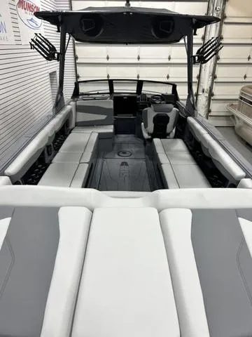 Slide: The Image of 2024 Axis Wake Research T250 boat interior with sleek seating and modern design. - 11