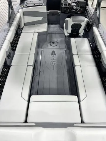 Slide: The Image of 2024 Axis Wake Research T250 boat interior with spacious seating and modern design. - 12