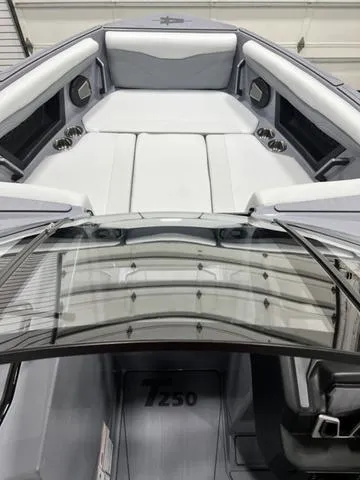 Slide: The Image of 2024 Axis Wake Research T250 boat interior with sleek seating and modern design. - 13