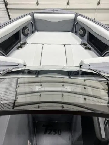 Slide: The Image of 2024 Axis Wake Research T250 boat interior with sleek seating and modern design. - 14