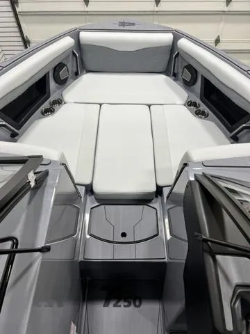 Slide: The Image of 2024 Axis Wake Research T250 boat interior with sleek seating and modern design. - 15
