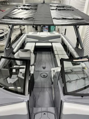 Slide: The Image of 2024 Axis Wake Research T250 boat interior with spacious seating and modern design. - 16