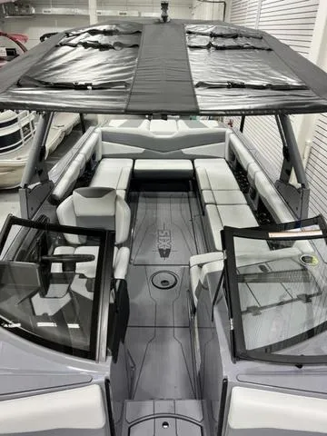 Slide: The Image of 2024 Axis Wake Research T250 boat interior with spacious seating and modern design. - 17