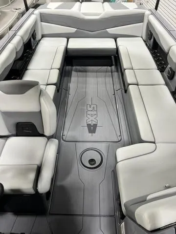 Slide: The Image of 2024 Axis Wake Research T250 boat interior with spacious seating and sleek design. - 18