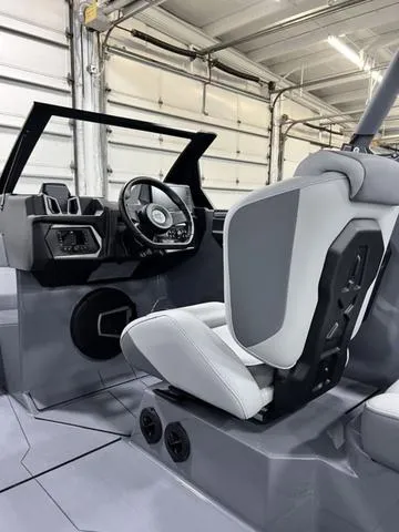 Slide: The Image of 2024 Axis Wake Research T250 boat interior with modern steering and seating. - 19