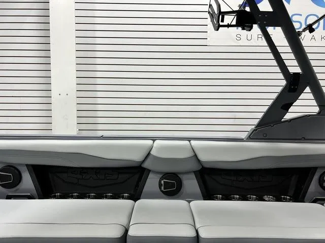 Slide: The Image of 2024 Axis Wake Research T250 boat interior with sleek seating and modern design. - 23