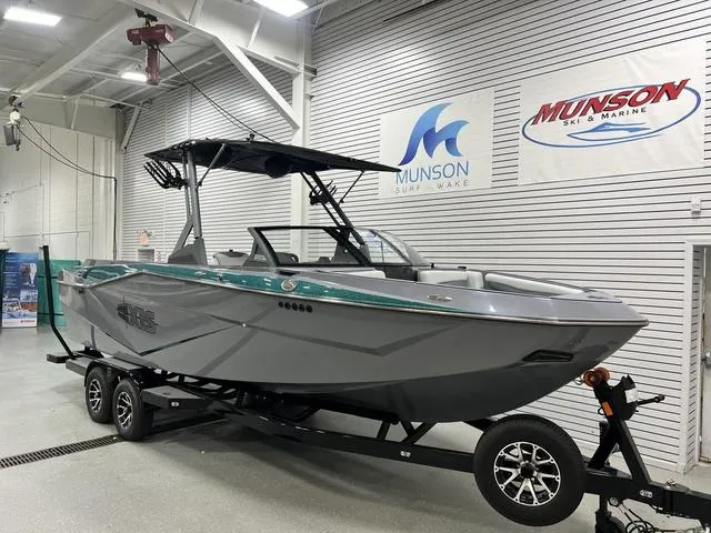 Slide: The Image of 2024 Axis Wake Research T250 boat on trailer in showroom. - 5