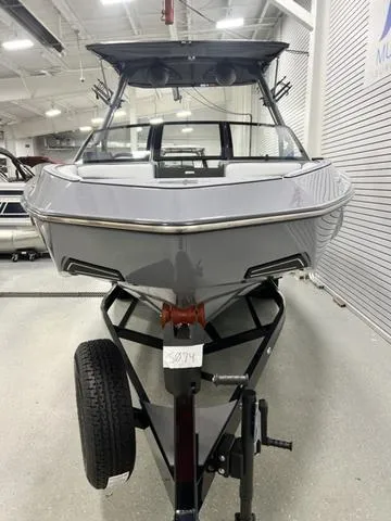 Slide: The Image of 2024 Axis Wake Research T250 boat on trailer in showroom. - 7