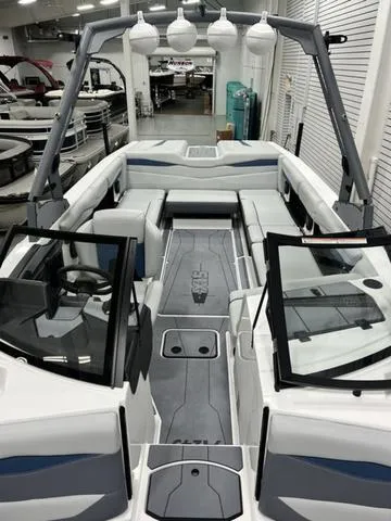 Slide: The Image of 2024 Axis Wake Research A245 boat interior with modern seating and sleek design. - 10
