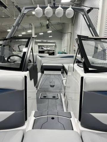 Slide: The Image of 2024 Axis Wake Research A245 boat interior with modern design and spacious seating. - 11