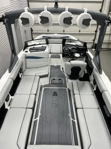 Slide: The Image of 2024 Axis Wake Research A245 boat interior with sleek seating and advanced controls. - 7