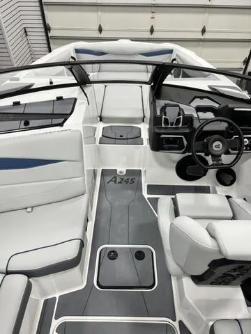 Slide: The Image of 2024 Axis Wake Research A245 boat interior with modern design and sleek dashboard. - 8